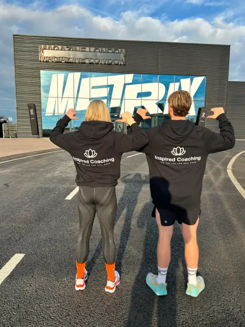 Lewis and Charlotte competing in Inspired Coaching kit at a Hyrox event